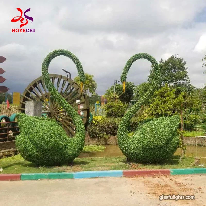 A természet és a művészet fúziója: nagy zöld állati növényszobrok